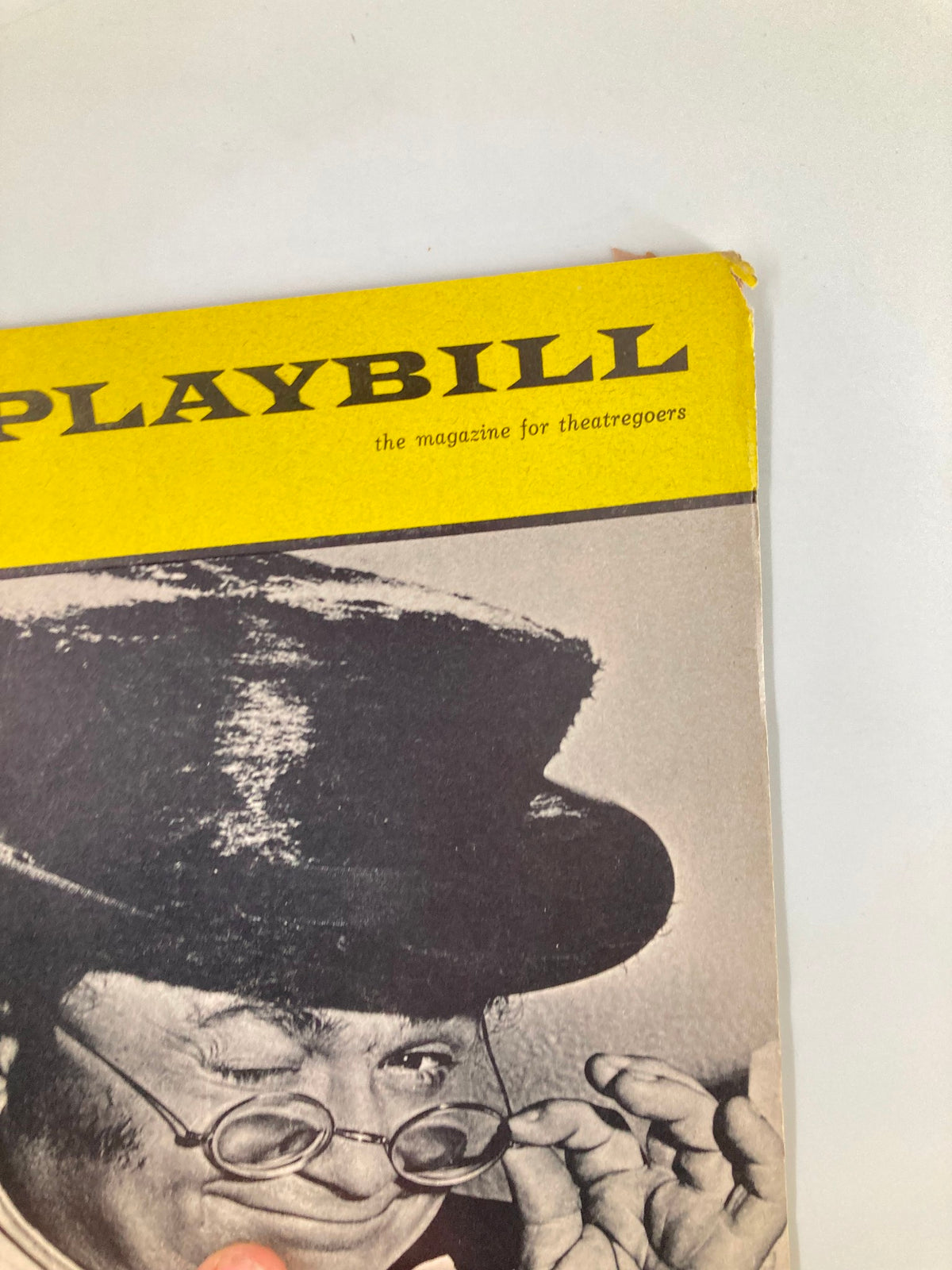 Close-up of the 1965 Playbill National Theatre 'Pickwick', highlighting the top of the cover with a vintage design and Harry Secombe's expressive face, capturing the essence of classic theatre.