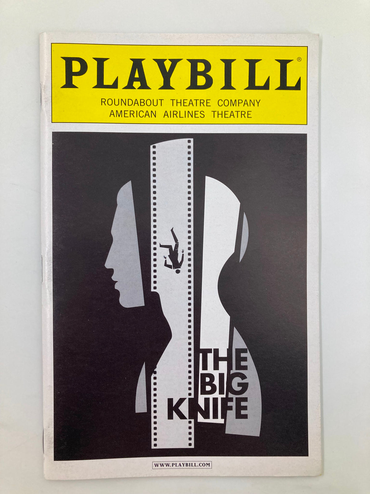 2013 Playbill for 'The Big Knife' at the American Airlines Theatre, featuring a striking graphic design with a silhouette of a person.