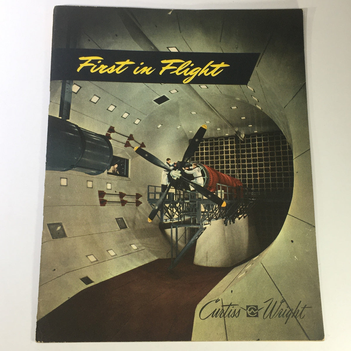 1943 Rare First in Flight Curtiss-Wright magazine cover featuring an aerodynamic wind tunnel with a propeller and an aircraft model, showcasing aviation research and design.