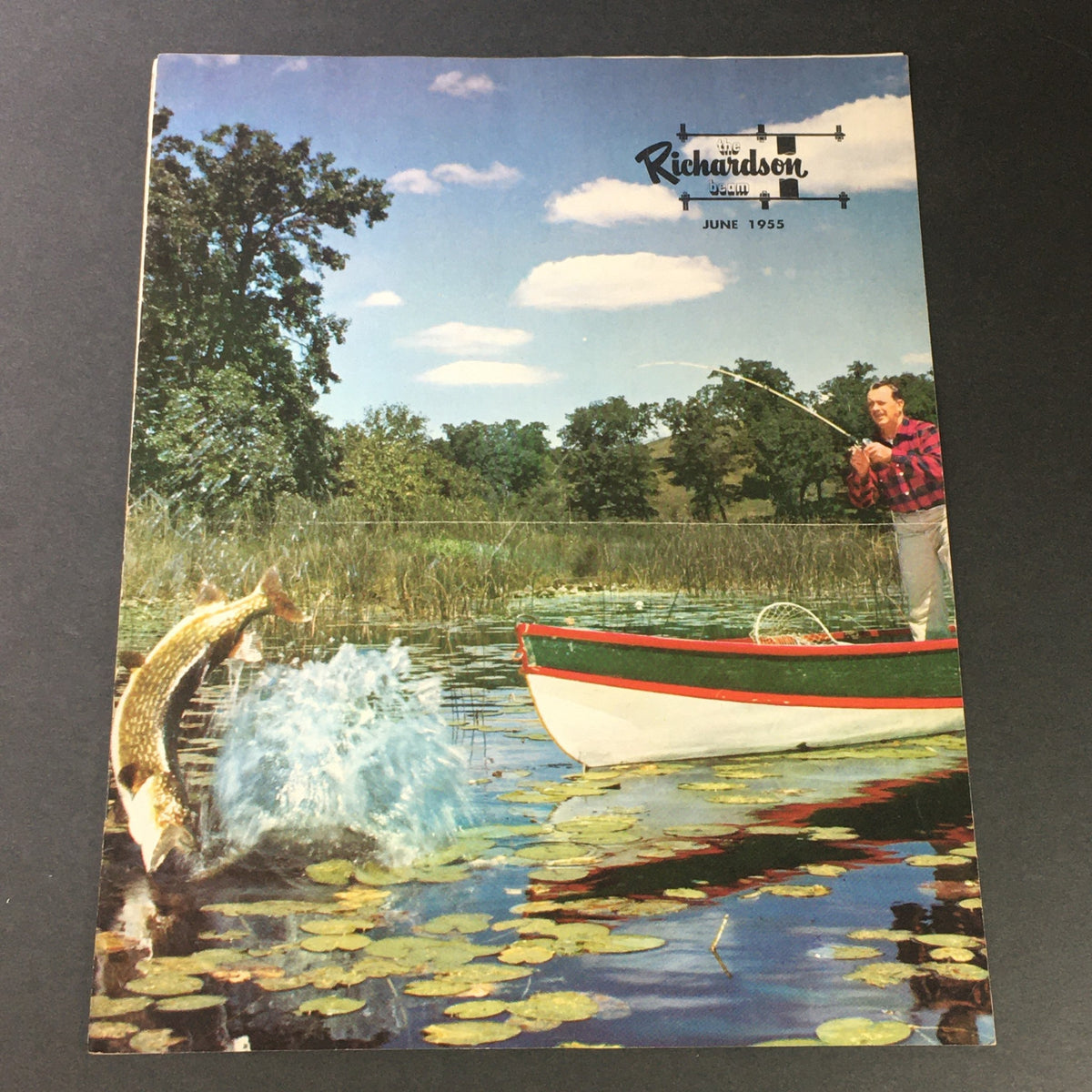 Cover image of VTG The Richardson Beam June 1955 showcasing a picturesque scene with fishing and a departing fish, representing the innovative G.E. Automated Sand Formulation Process.