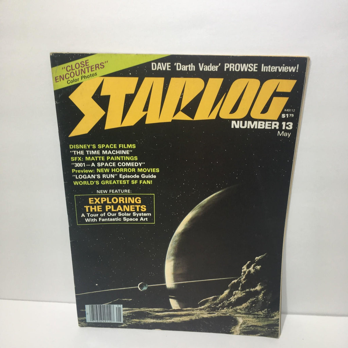 Cover of Starlog Magazine Number 13 featuring Dave 'Darth Vader' Prowse Interview, with highlights on Disney's Space Films, The Time Machine, and a new feature exploring the planets. Vintage sci-fi collectible from May 1978.