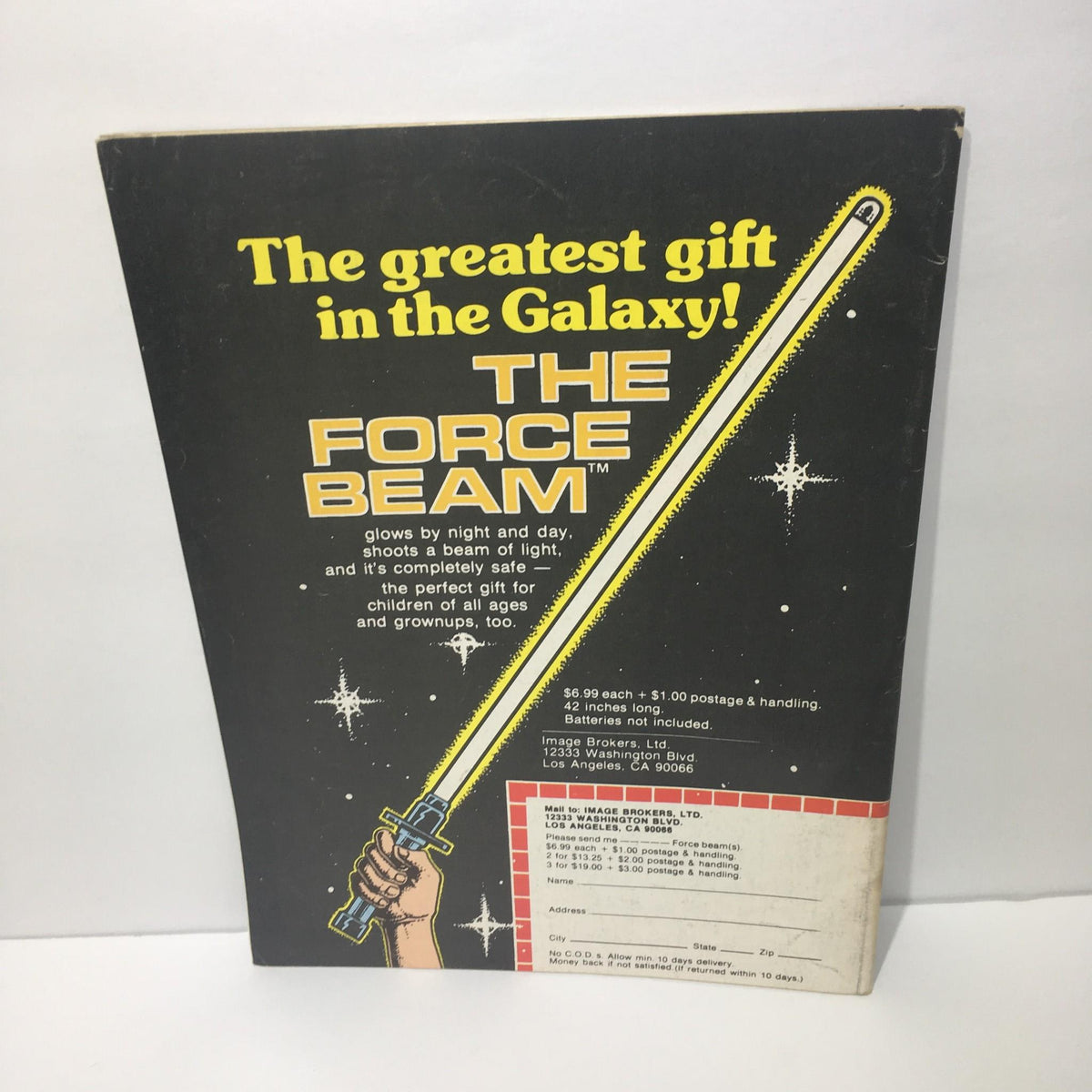Promotional page for 'The Force Beam' toy found in Starlog Magazine Number 13, featuring graphics and pricing details for the sci-fi item.