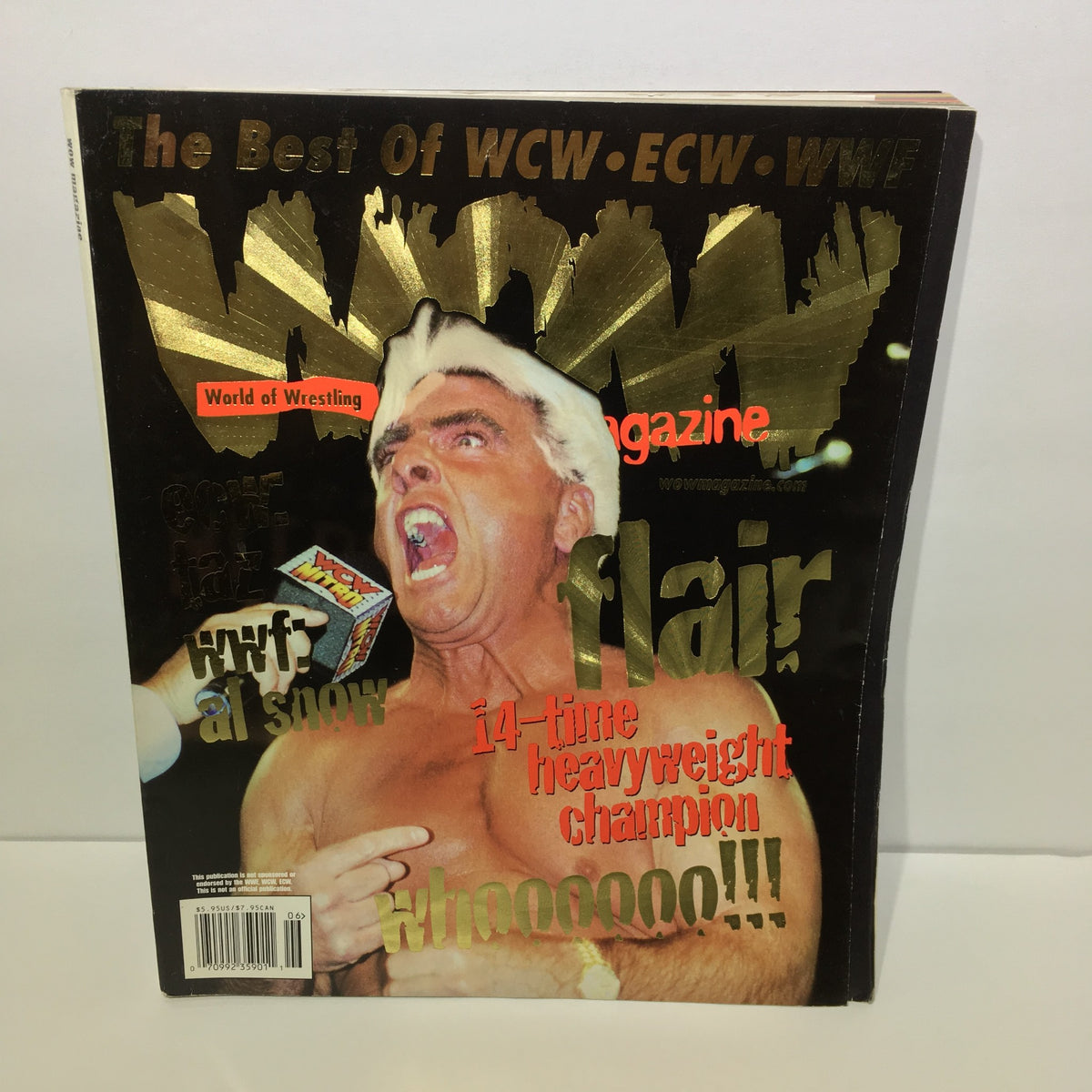 Cover image of Wow Magazine: The Best of WCW - ECW - WWF June 1999 Vol. 1 Issue 2 featuring a dynamic wrestler celebrating with a vibrant design.