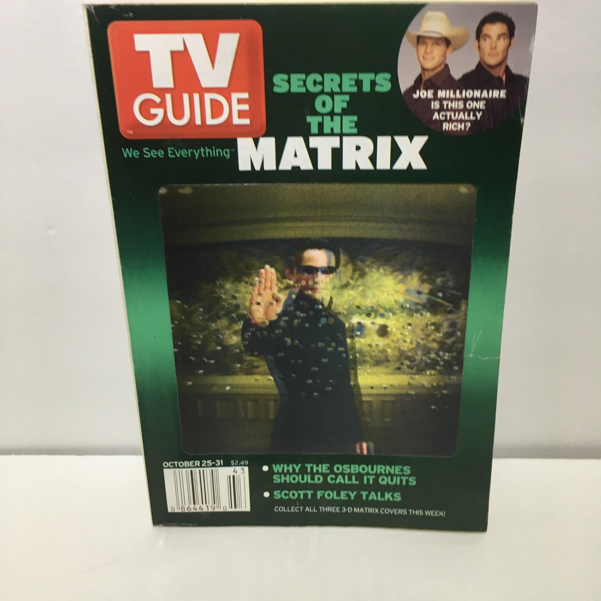 TV Guide cover featuring Keanu Reeves with the title 'TV Guide October 25-31 2003 Matrix Keanu Reeves Cover'. The cover highlights 'Secrets of the Matrix' and includes articles about The Osbournes and Scott Foley.