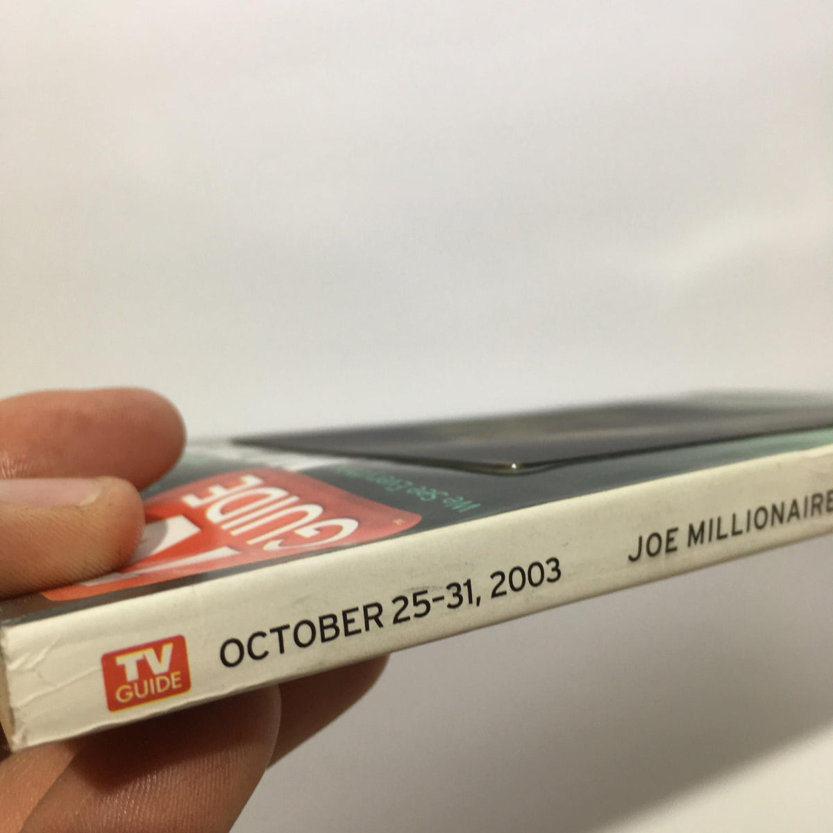 Side view of TV Guide October 25-31, 2003 featuring Joe Millionaire, showing the publication date and branding.