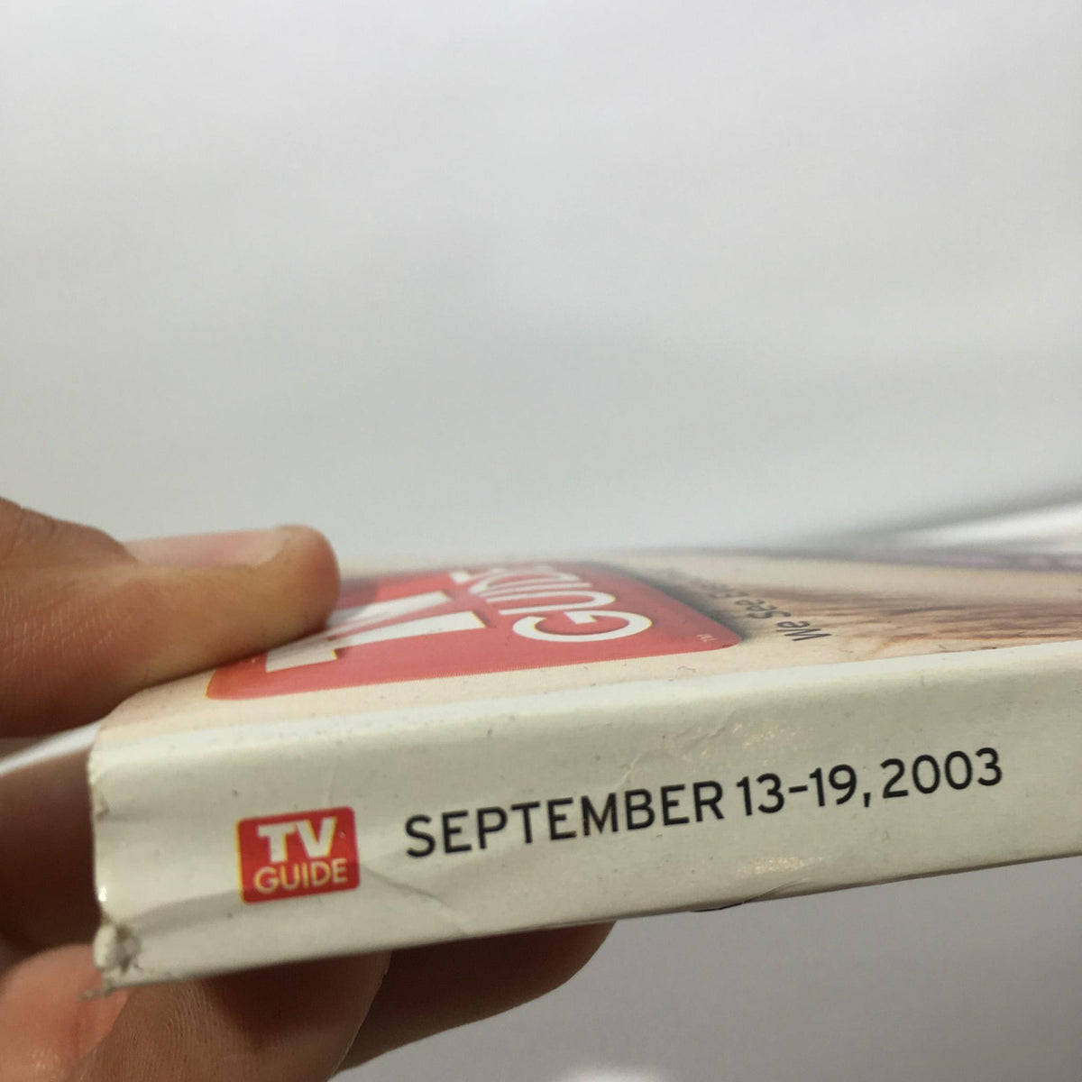 Spine view of TV Guide Sept 13-19 2003 displaying the publication date clearly labeled as 'September 13-19, 2003' for easy reference.