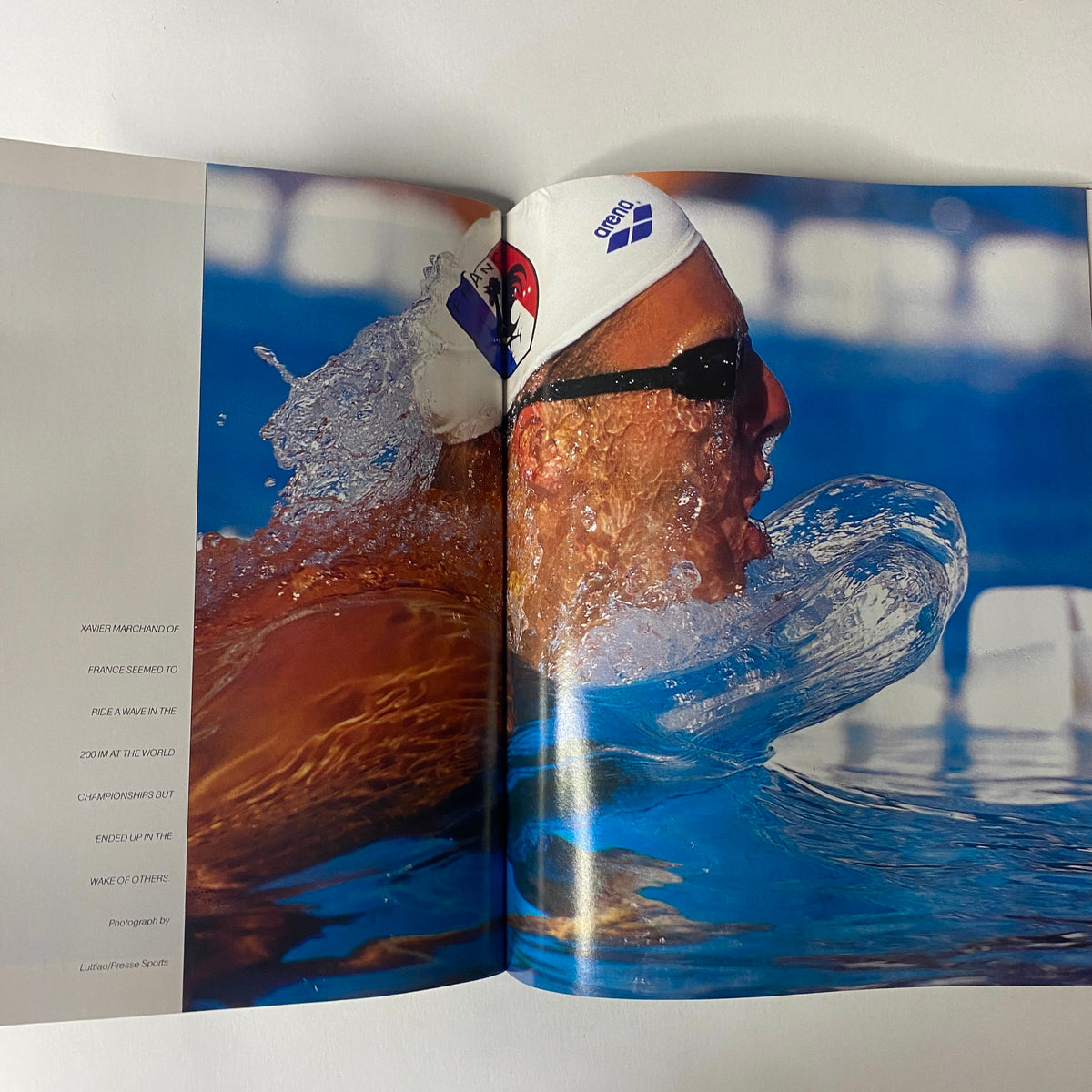 Sports Illustrated Magazine 1994 Year in Pictures capturing a swimmer in motion during a competitive event, illustrating the athletic prowess and excitement of the swimming world championships.
