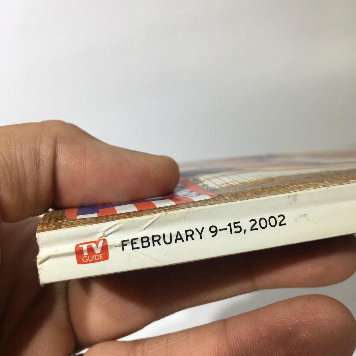 Side view of TV Guide from February 9-15, 2002, showing the publication date and logo.