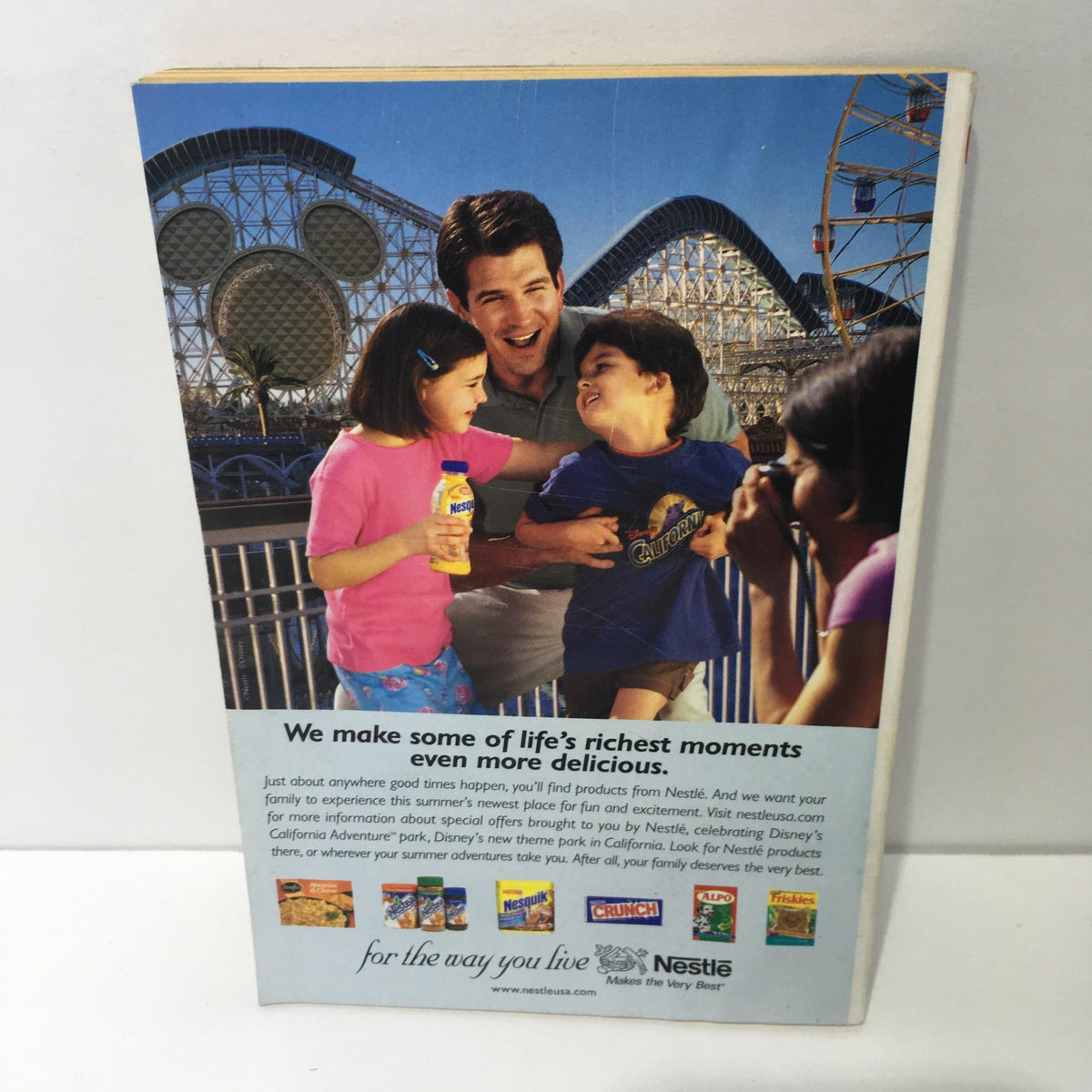 Back cover of the TV Guide May 12-18, 2001, featuring a family at an amusement park with brand advertisements.