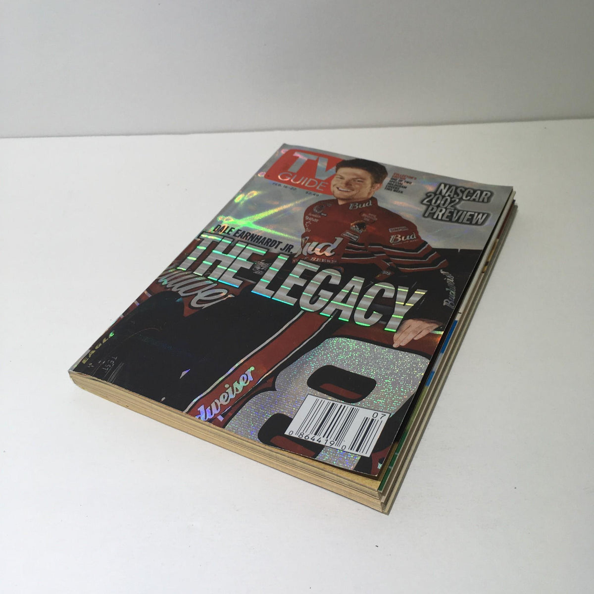 Front cover of the TV Guide February 16-22 2002 showcasing Dale Earnhardt Jr. titled 'The Legacy'.