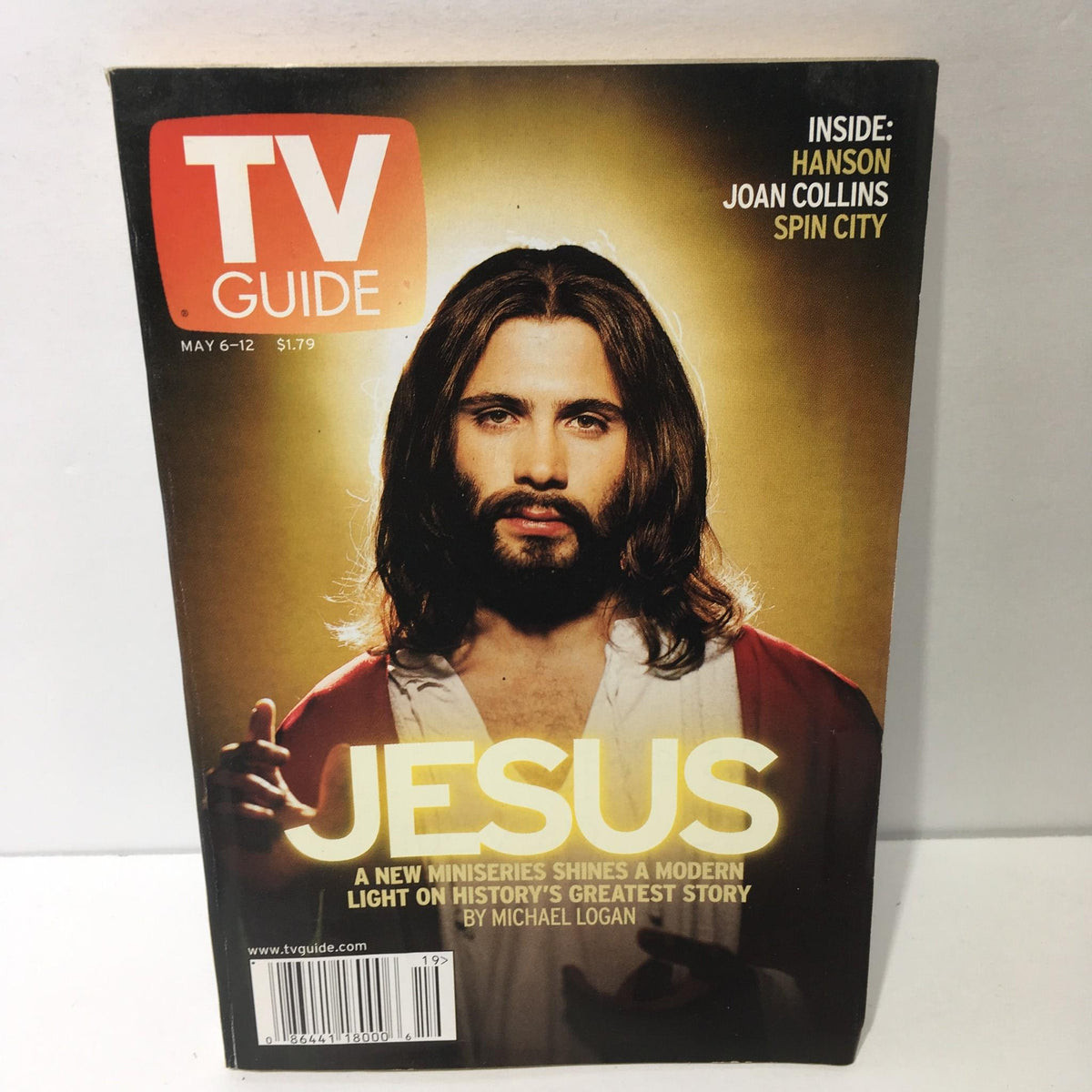 TV Guide May 6-12 2000 featuring a cover story titled 'Jesus' by Michael Logan. The cover showcases a man with long hair and a beard, dressed in a red robe, emphasizing the theme of a modern miniseries that sheds light on history's greatest story.