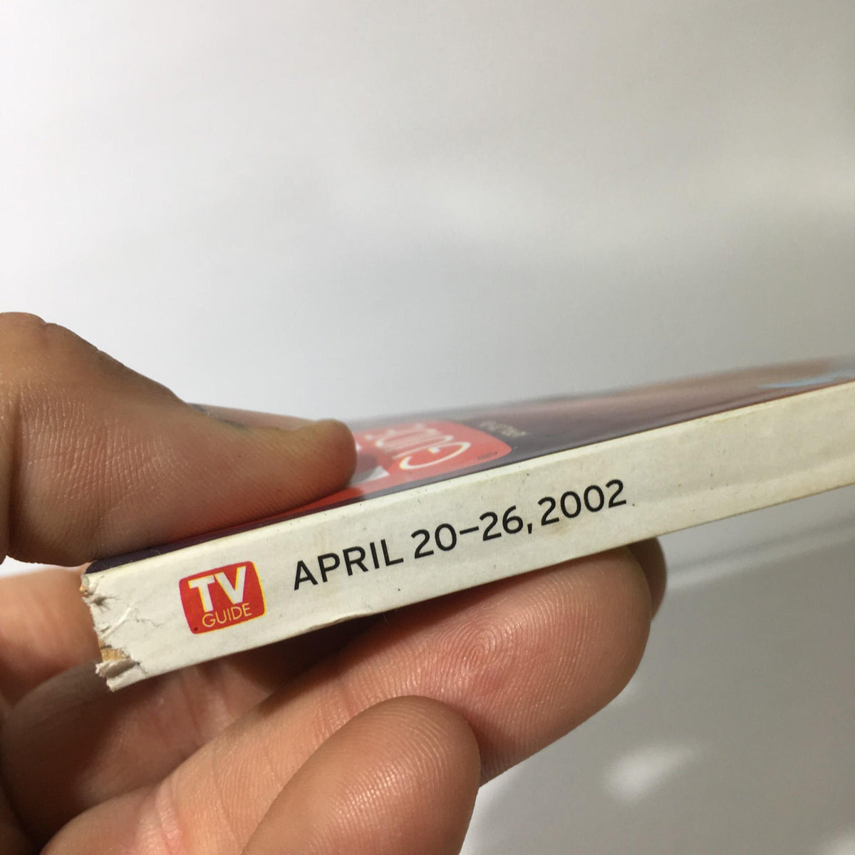 Side view of the TV Guide April 20-26 2002 showing the publication date and the iconic TV Guide logo.