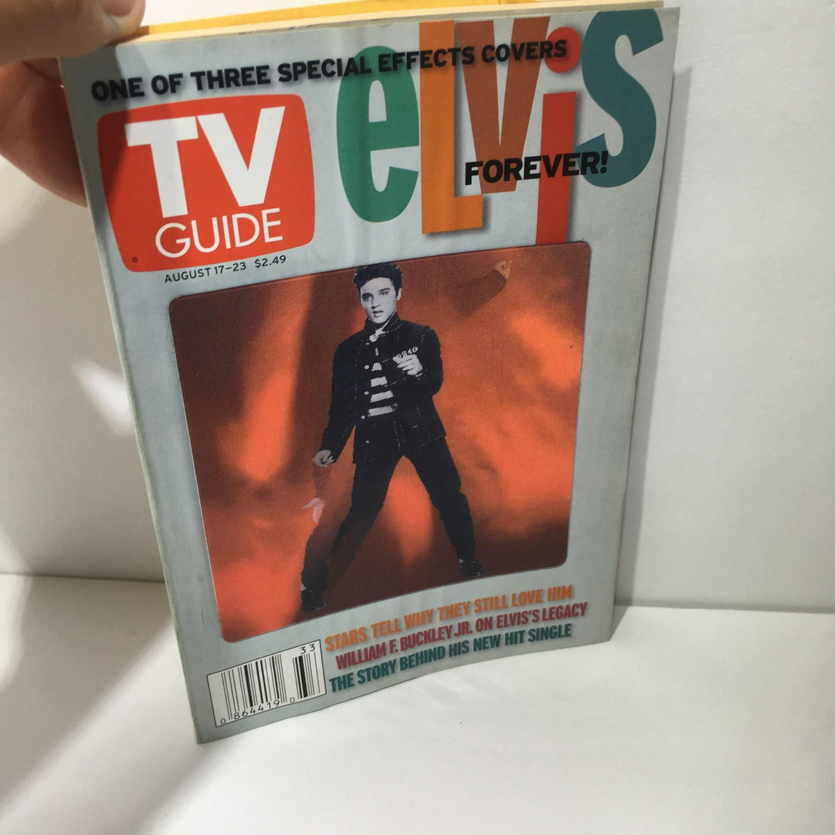 TV Guide August 17-23 2002 featuring Elvis Presley on the cover, highlighting his legacy with a special effects design and featuring the headline 'elvis Forever!'. A classic collectible for fans of music history.