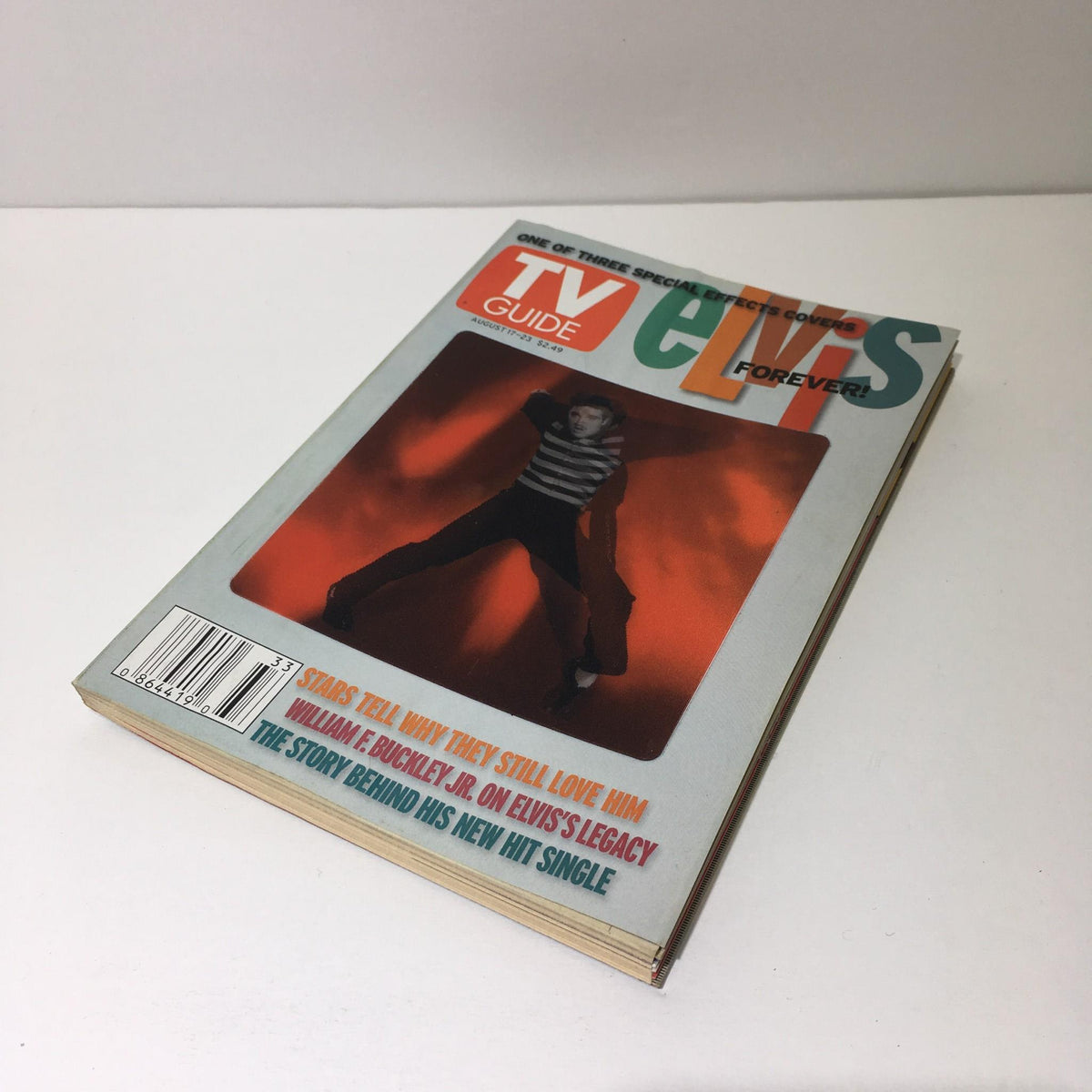 Another view of the front cover of TV Guide August 17-23 2002, emphasizing the iconic image of Elvis Presley with bold text.