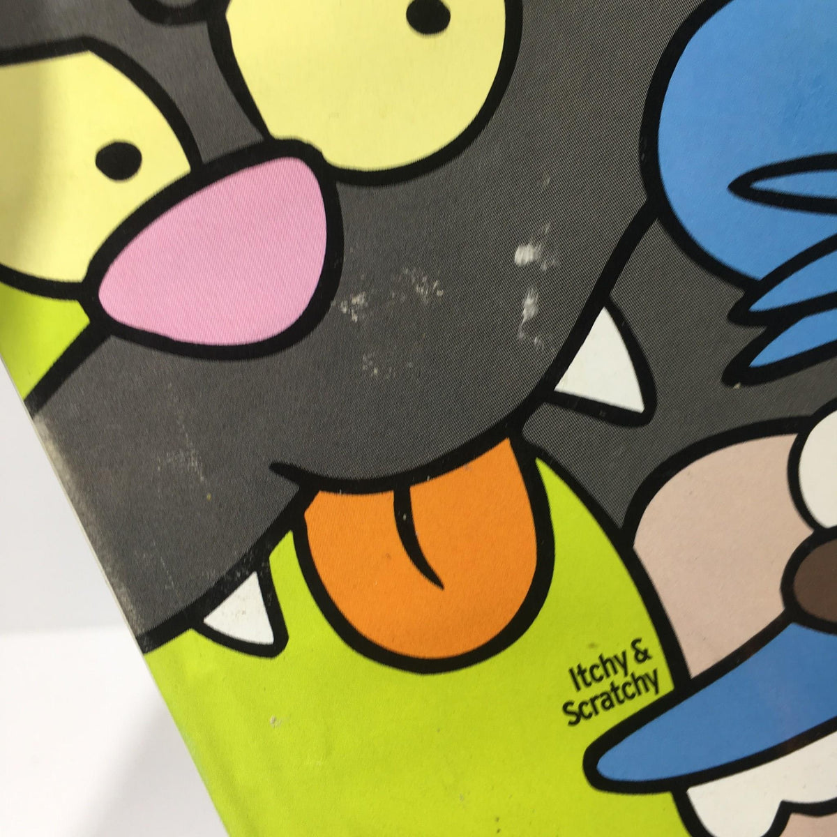 Close-up of the Itchy & Scratchy artwork on the TV Guide cover from October 21-27, 2000, with visible mild wear.