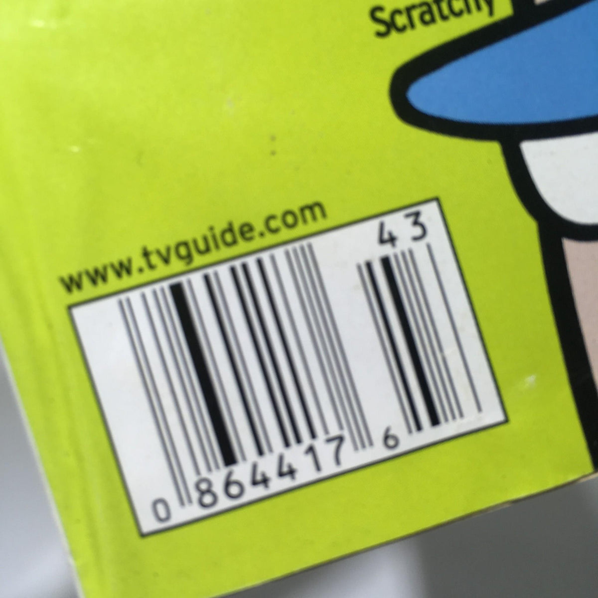Back cover of the TV Guide from October 21-27, 2000 displaying the barcode and publication information, featuring Itchy & Scratchy.