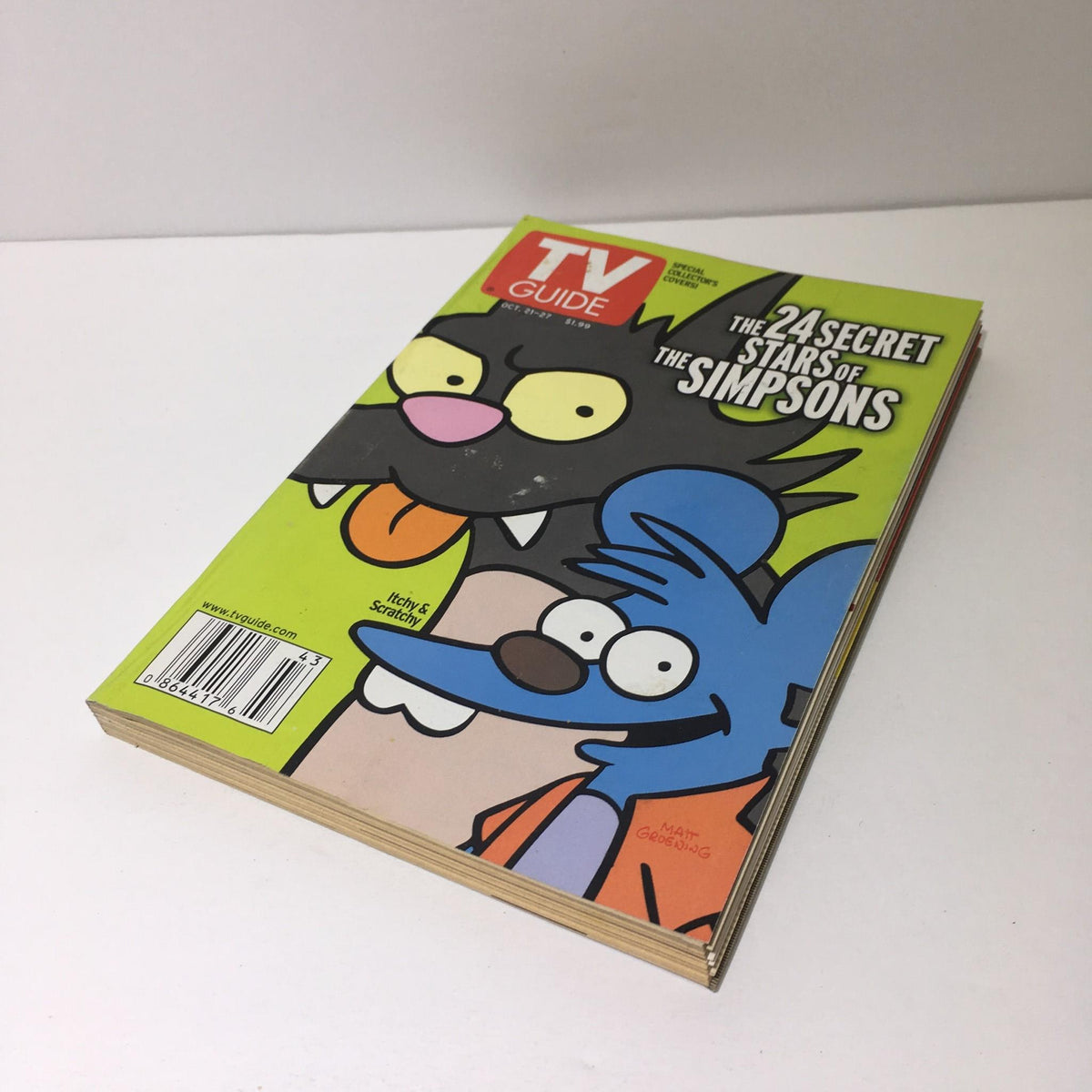 Front cover of TV Guide from Oct 21-27 2000, titled 'The 24 Secret Stars of The Simpsons,' showcasing cartoon characters Itchy and Scratchy.