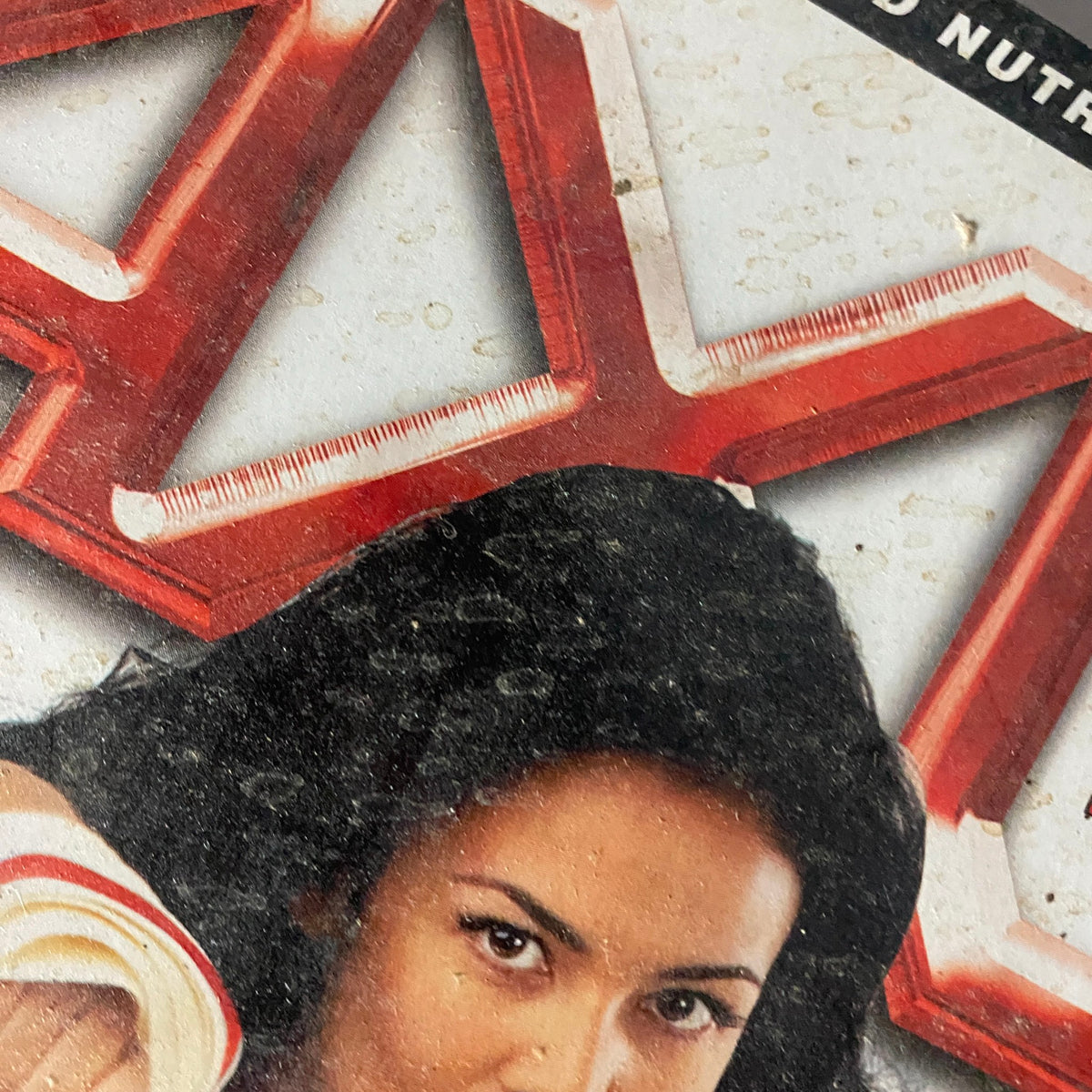Close-up detail of AXL Magazine 2002 Vol 1 No. 6 cover with Ava Fiore, highlighting her fierce expression and the magazine's bold design.