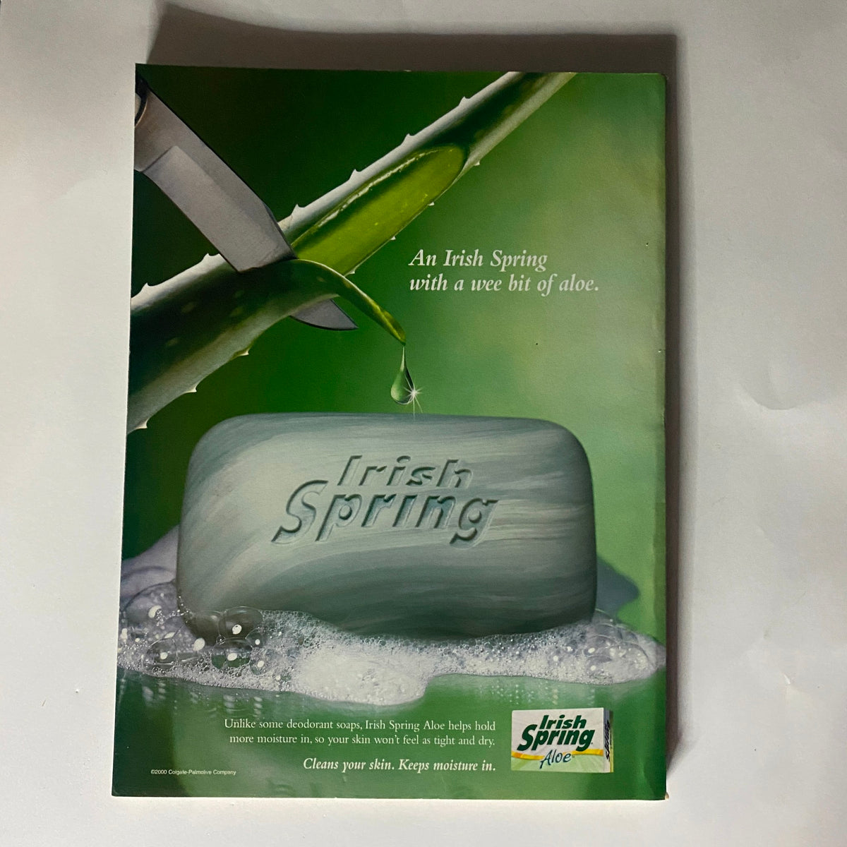 Advertisement for Irish Spring soap showcasing a bar of soap with aloe vera, emphasizing moisturizing benefits; caption states 'An Irish Spring with a wee bit of aloe'.