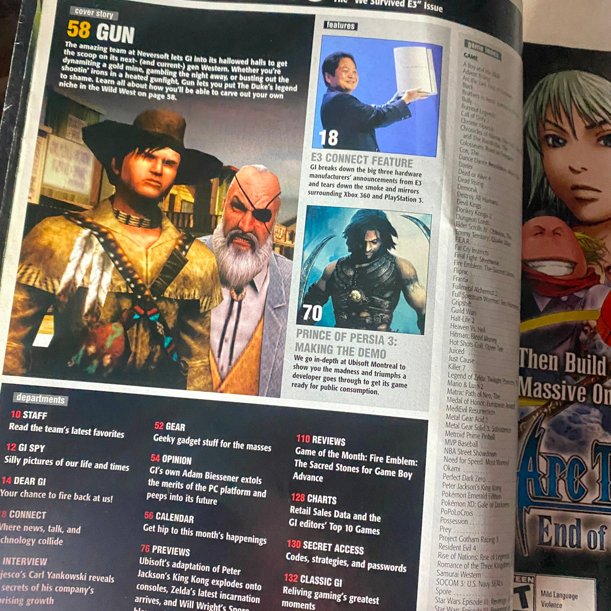 Inside page of Game Informer Magazine July 2005 Issue 147 showcasing featured articles including 'Gun' and E3 coverage with colorful graphics.