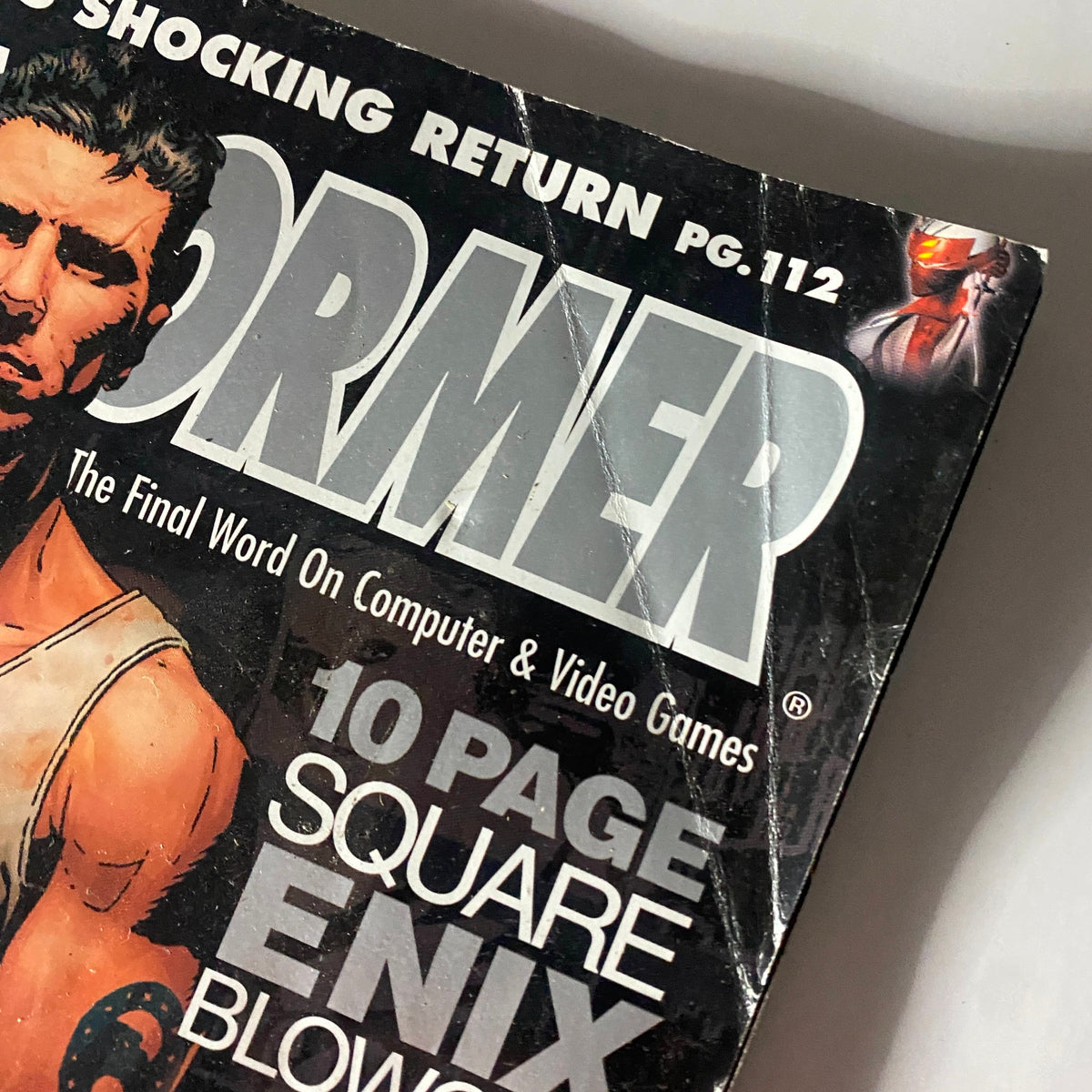 Close-up of the Game Informer Magazine November 2003 Issue 127, emphasizing the dramatic cover title and artwork for Dead to Rights II, a significant video game from its era.