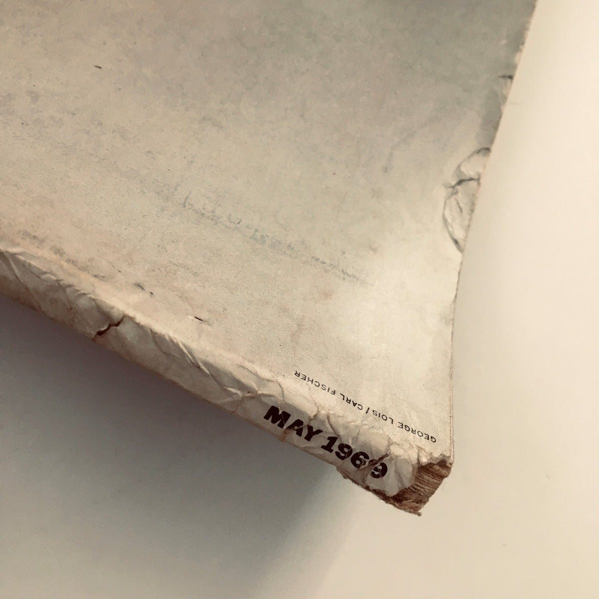 Close-up view of the spine of Esquire Magazine May 1969, featuring signs of aging and the month and year printed on the bottom.
