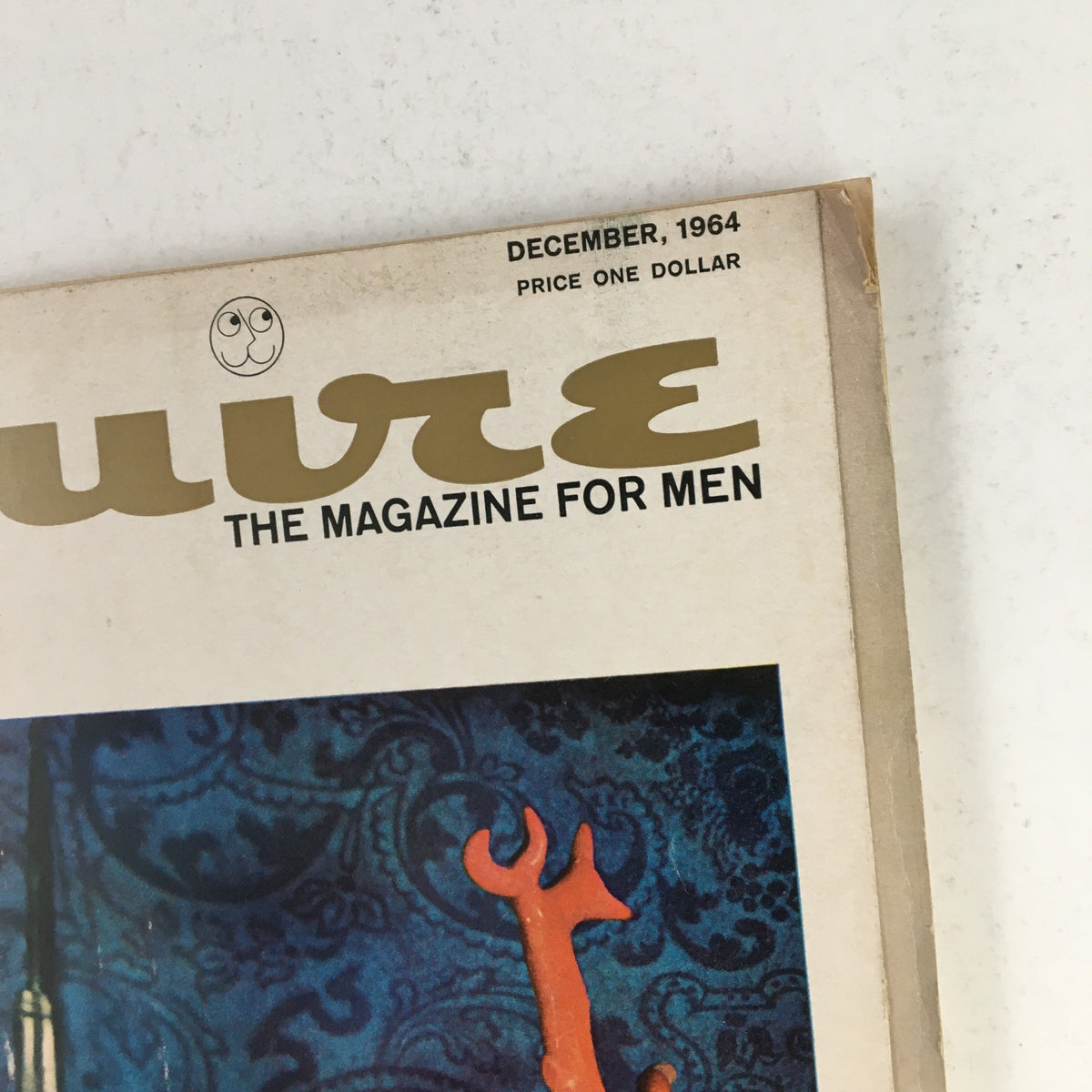 Close-up of the title 'Esquire' on the December 1964 magazine cover, highlighting its vintage design.