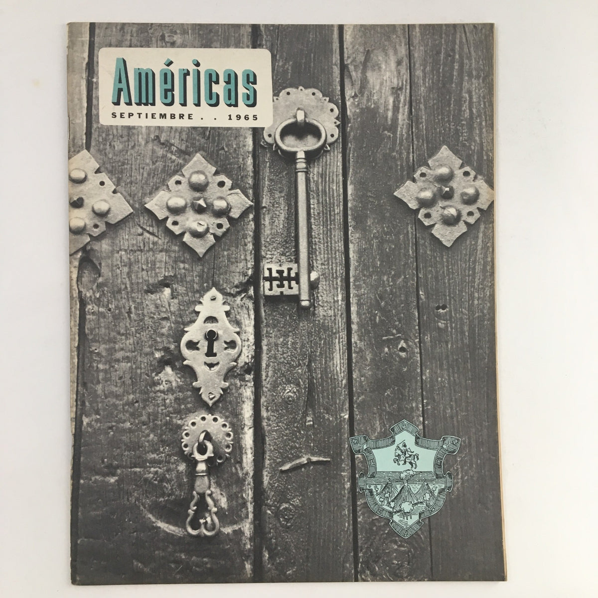 Cover of Americas Magazine from September 1965 featuring intricate designs of antique keys and locks on weathered wood, promoting the theme 'The OAS in Action'.