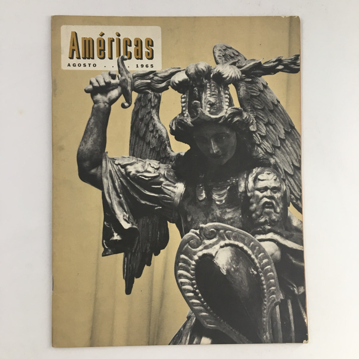 Cover of Americas Magazine Agosto August 1965 featuring a Warrior Angel sculpture, showcasing mid-20th century art and culture.