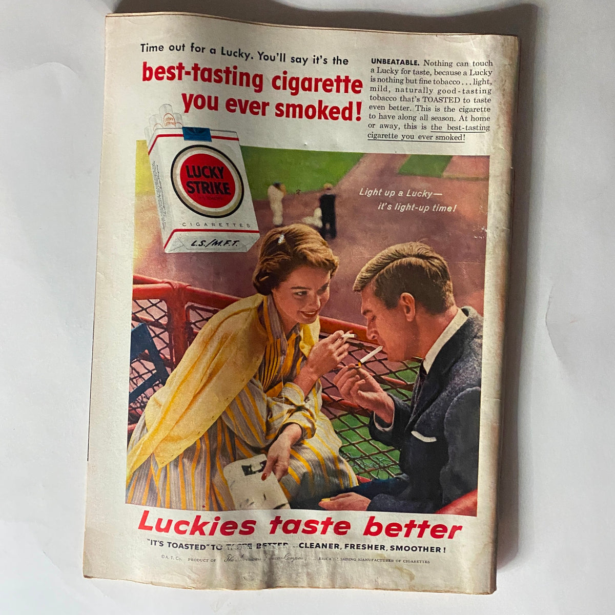 Advertisement for Lucky Strike cigarettes from VTG Time Magazine May 6, 1957 Vol 69 No. 18, showcasing a couple enjoying a cigarette together.
