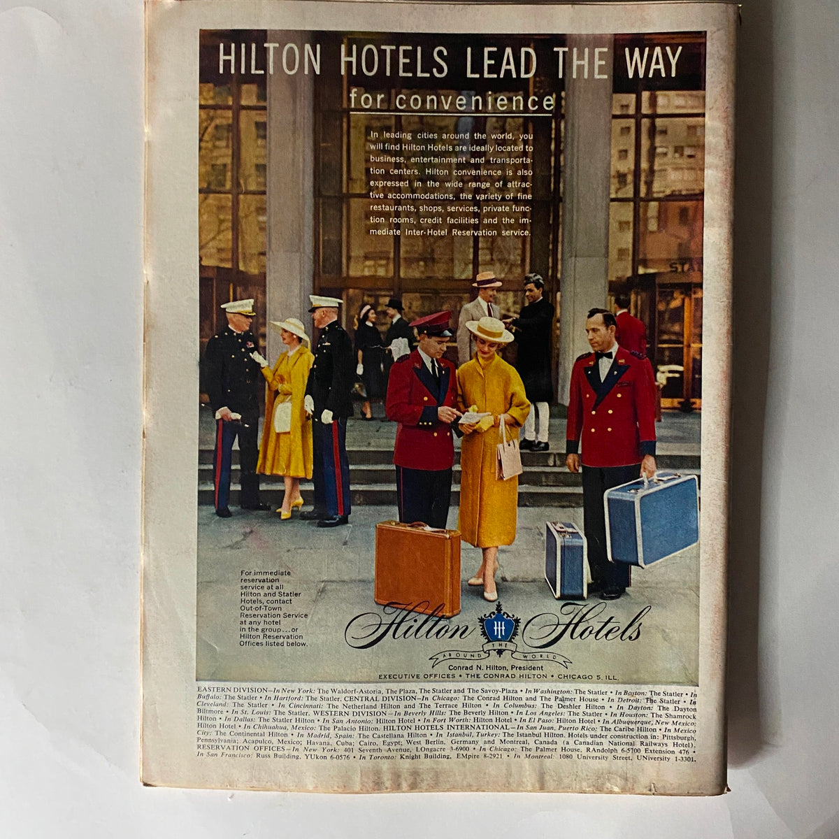 Back cover of Vintage Time Magazine from April 22, 1957, showcasing an advertisement for Hilton Hotels and emphasizing travel convenience.