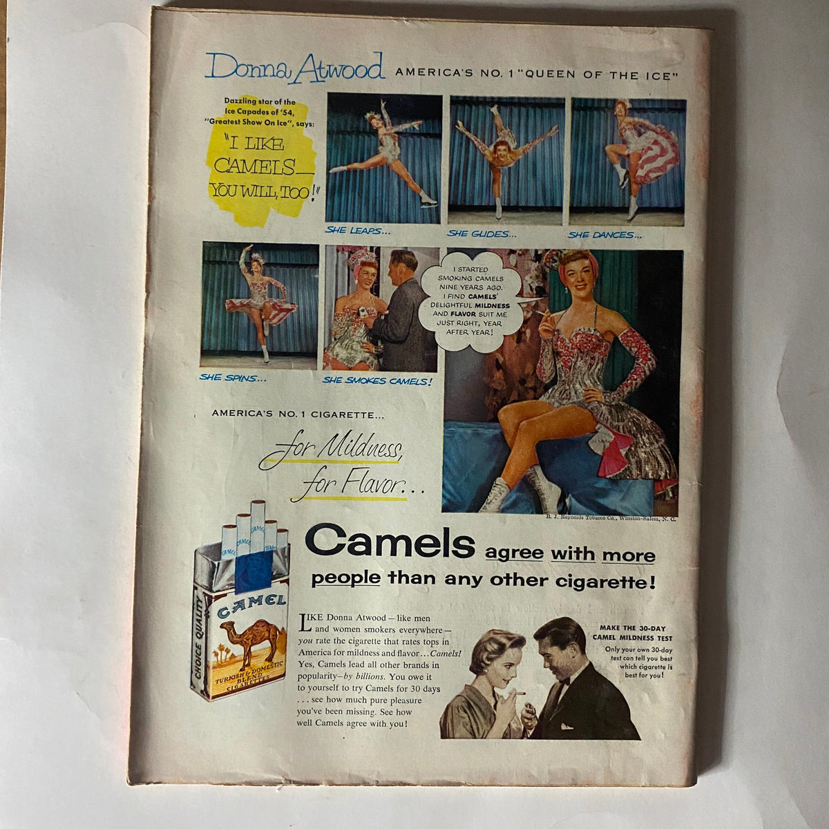 Vintage Time Magazine February 22, 1954, featuring a cigarette advertisement with Donna Atwood, highlighting Camel cigarettes and promoting their mild flavor.