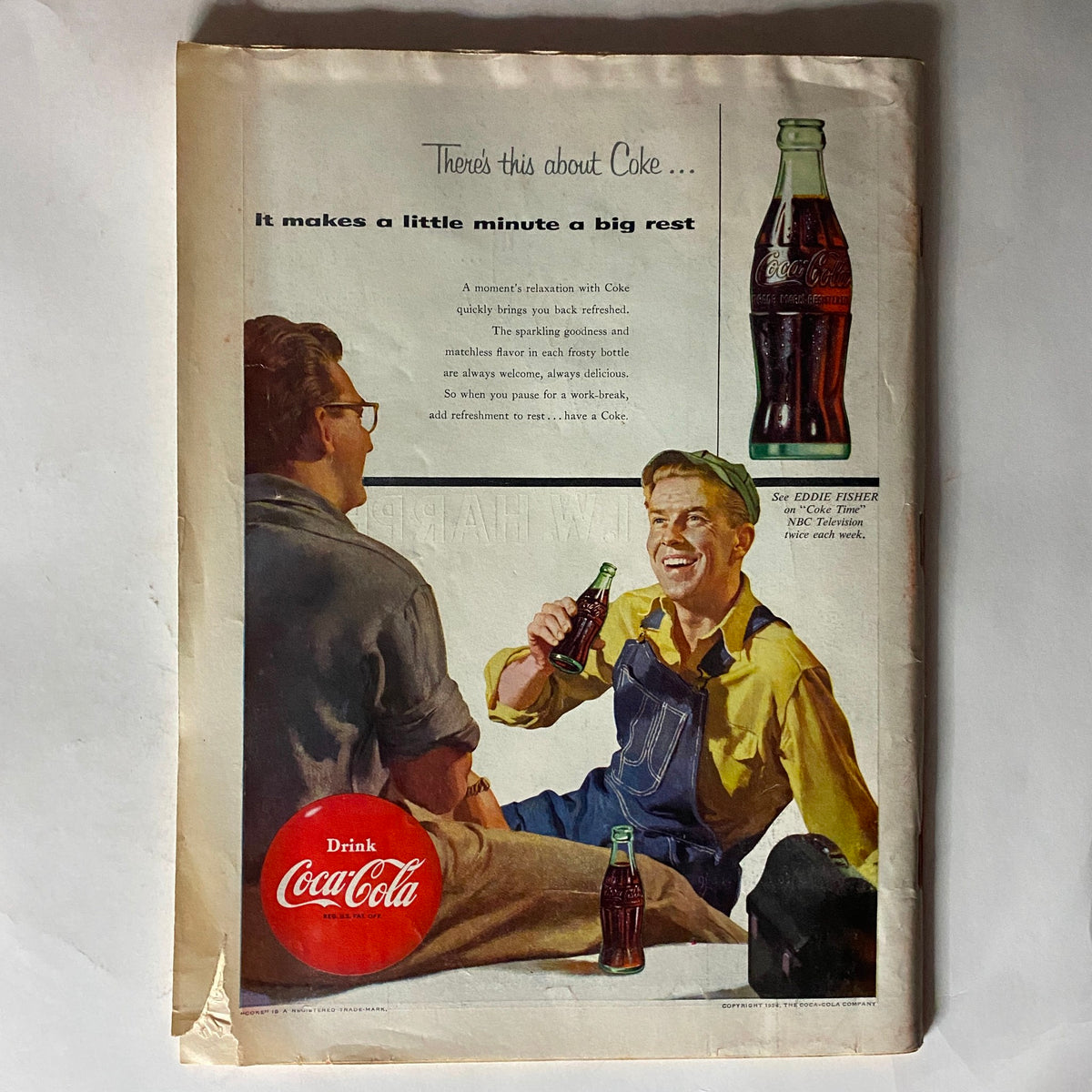 Back cover of VTG Time Magazine from April 12, 1954, featuring a Coca-Cola advertisement with two men enjoying drinks, highlighting 1950s Americana and leisure culture.