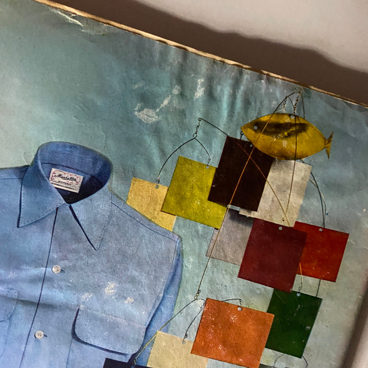 Close-up of the vintage Time Magazine cover from April 19, 1954, highlighting the blue shirt and colorful mobile elements, showcasing the artistic style of the 1950s.