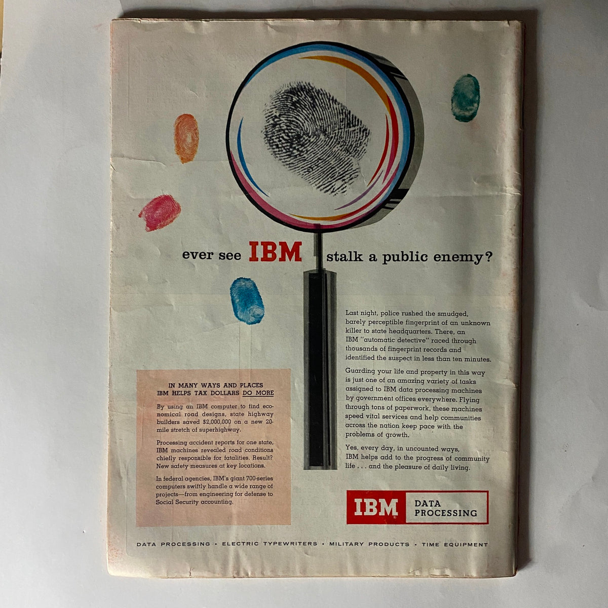 Vintage advertisement from Time Magazine July 22, 1957 featuring IBM data processing technology. The ad includes a magnifying glass over a fingerprint, highlighting the efficiency of IBM systems in crime detection, alongside colorful ink smudges.