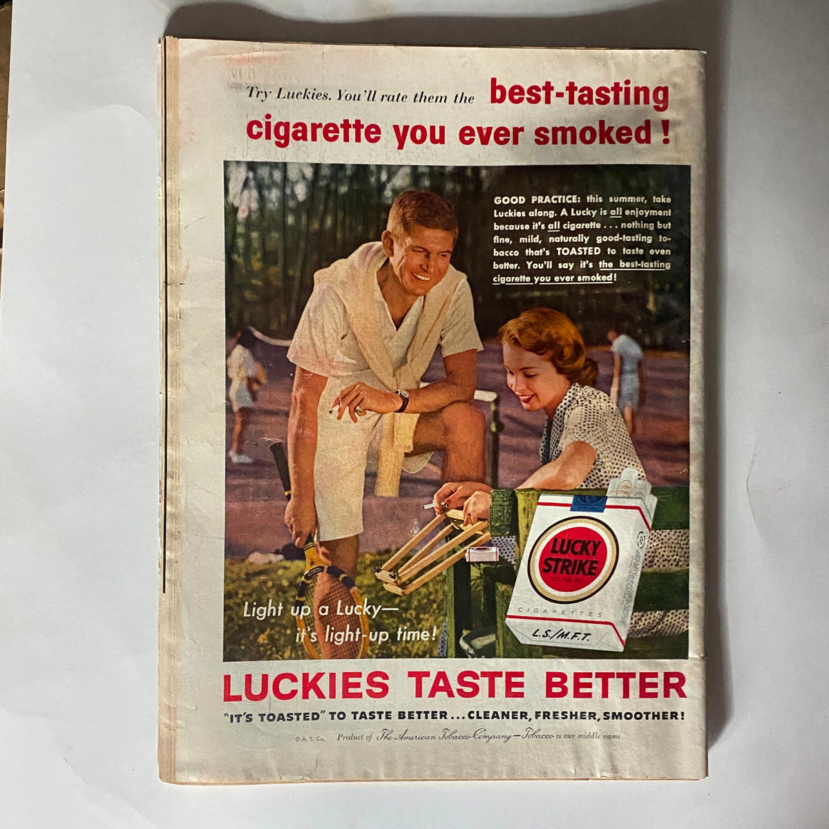 Vintage advertisement for Lucky Strike cigarettes featured in the VTG Time Magazine July 1, 1957 Vol 70 No. 1, showcasing a summer scene with two young adults enjoying leisure time.