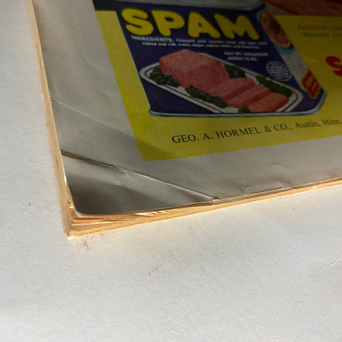 Close-up view of the vintage SPAM advertisement page from the VTG Time Magazine October 11, 1954, highlighting the texture and condition of the magazine.