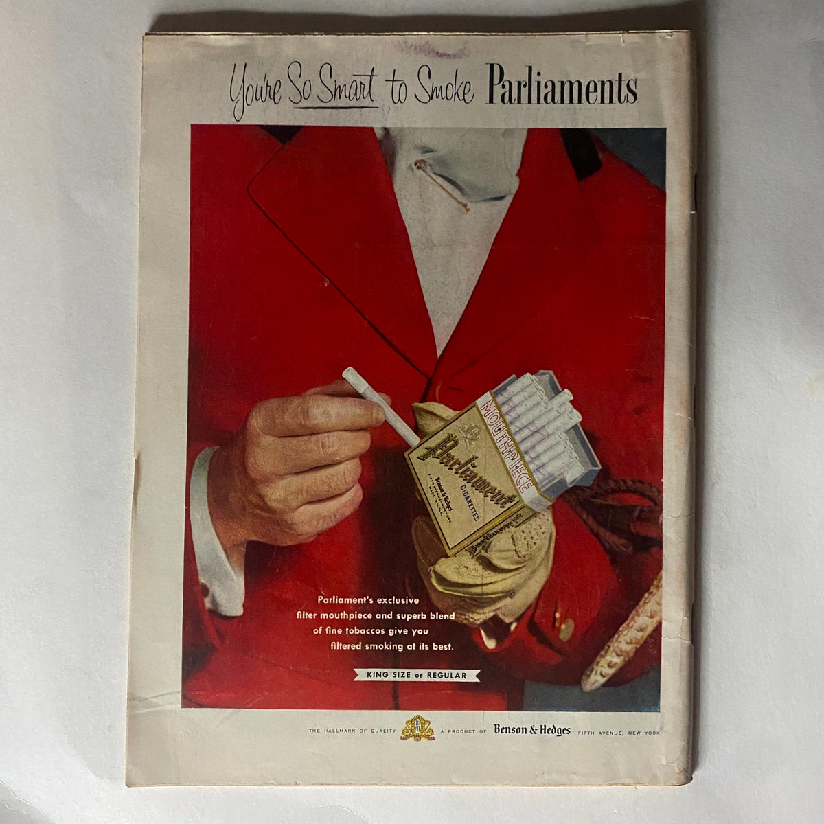 Cover of vintage Time Magazine from October 25, 1954, featuring evangelist Billy Graham, showcasing an advertisement with a man in a red coat holding a pack of Parliament cigarettes.
