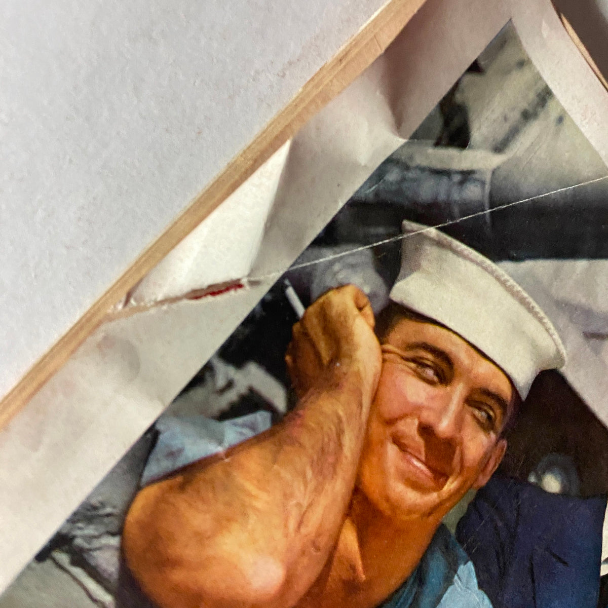 Close-up of the vintage advertisement from Time Magazine March 18, 1957, displaying a sailor smiling with New Parliament cigarette, capturing 1950s Americana.