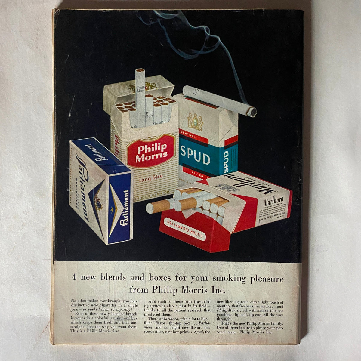 Back cover of VTG Time Magazine October 22, 1956 featuring advertisements for Philip Morris cigarettes, showcasing vintage marketing design.