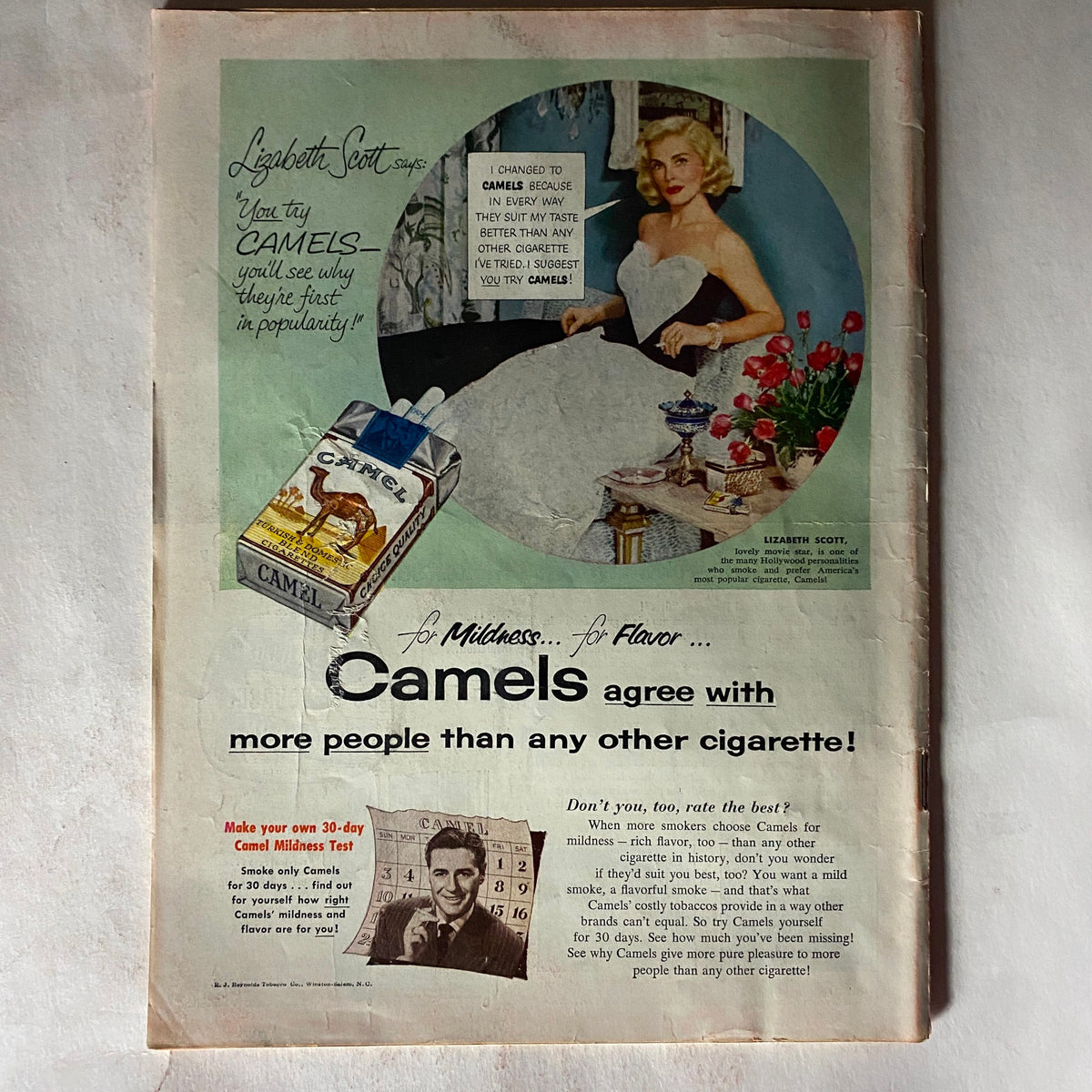 Advertisement page from VTG Time Magazine December 28, 1953 Vol 26 featuring Lizabeth Scott promoting Camel cigarettes in a stylish setting.
