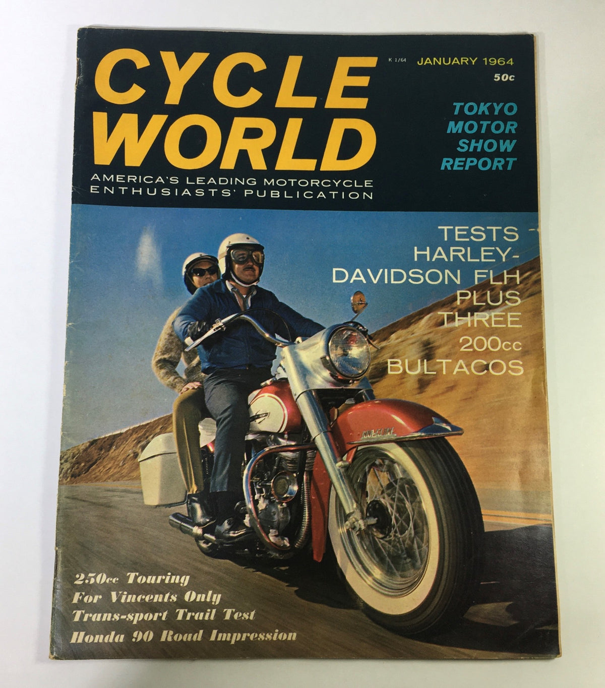 Cycle World Magazine from July 1964 featuring Harley Davidson, Bultaco 200cc, and Honda 90 with vibrant cover art showcasing classic motorcycle culture.