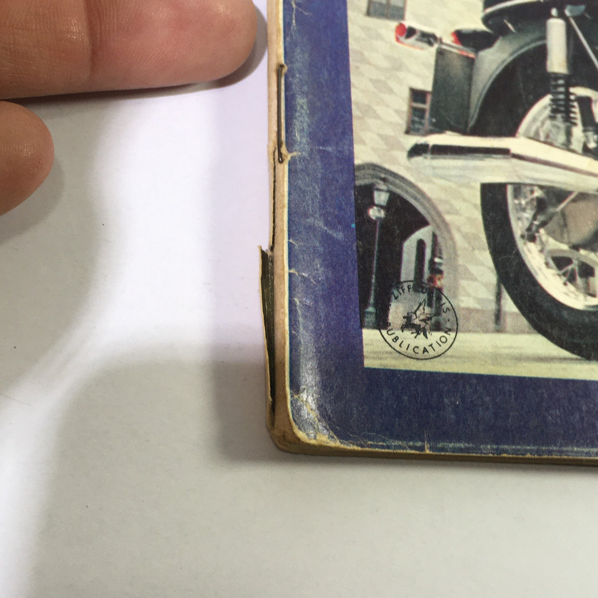 Close-up of Cycle Magazine November 1969 highlighting features of the muscular Honda 90 and BMW 750 with visible wear, capturing the vintage appeal.