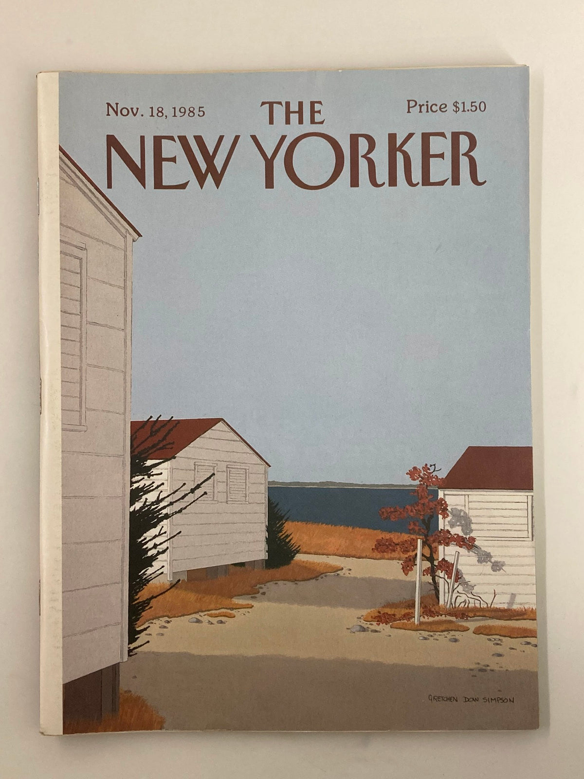 Cover of The New Yorker Full Magazine November 18, 1985 featuring cover art 'By The Shore' by Gretchen D. Simpson, depicting a coastal scene with houses and autumn foliage.