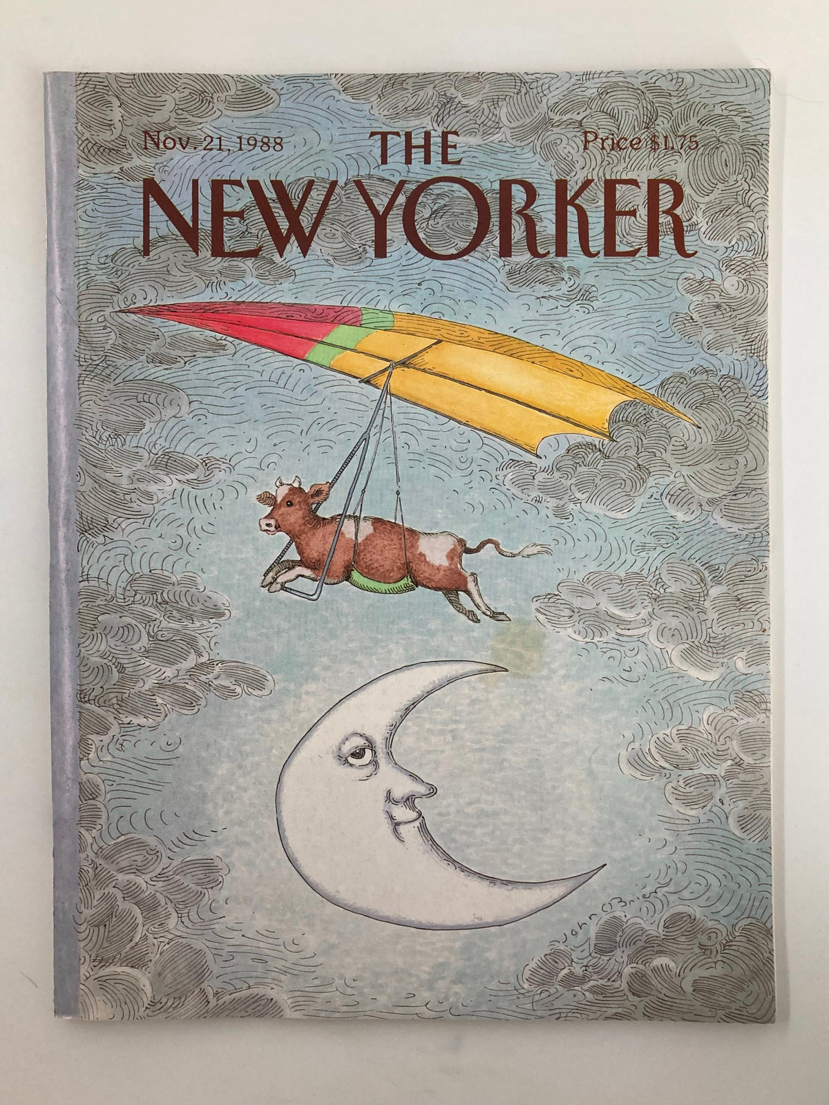 Cover of The New Yorker Full Magazine November 21, 1988 featuring 'Cow and the Moon' illustration by John O'Brien, showcasing a whimsical cow flying with a colorful hang glider above a crescent moon.