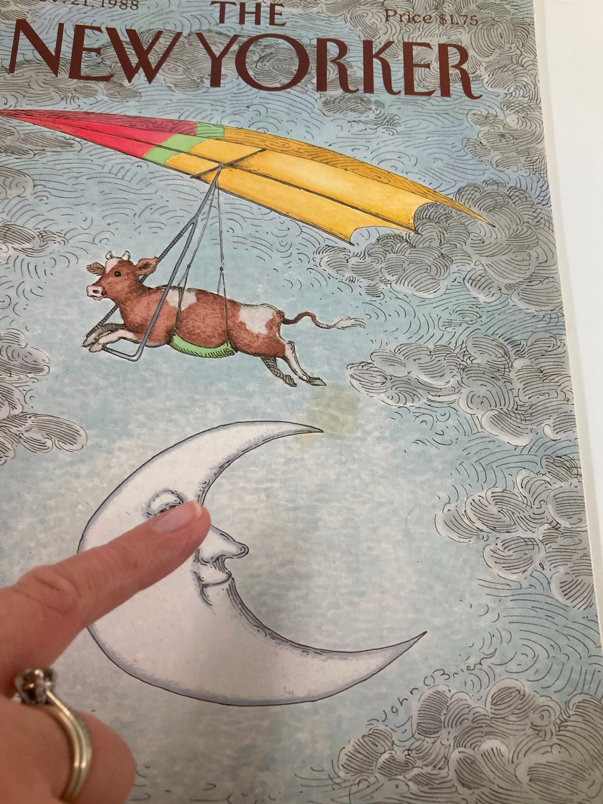 Close-up view of The New Yorker Full Magazine November 21, 1988 cover art 'Cow and the Moon' by John O'Brien, highlighting the playful cow and the illustrated moon face.