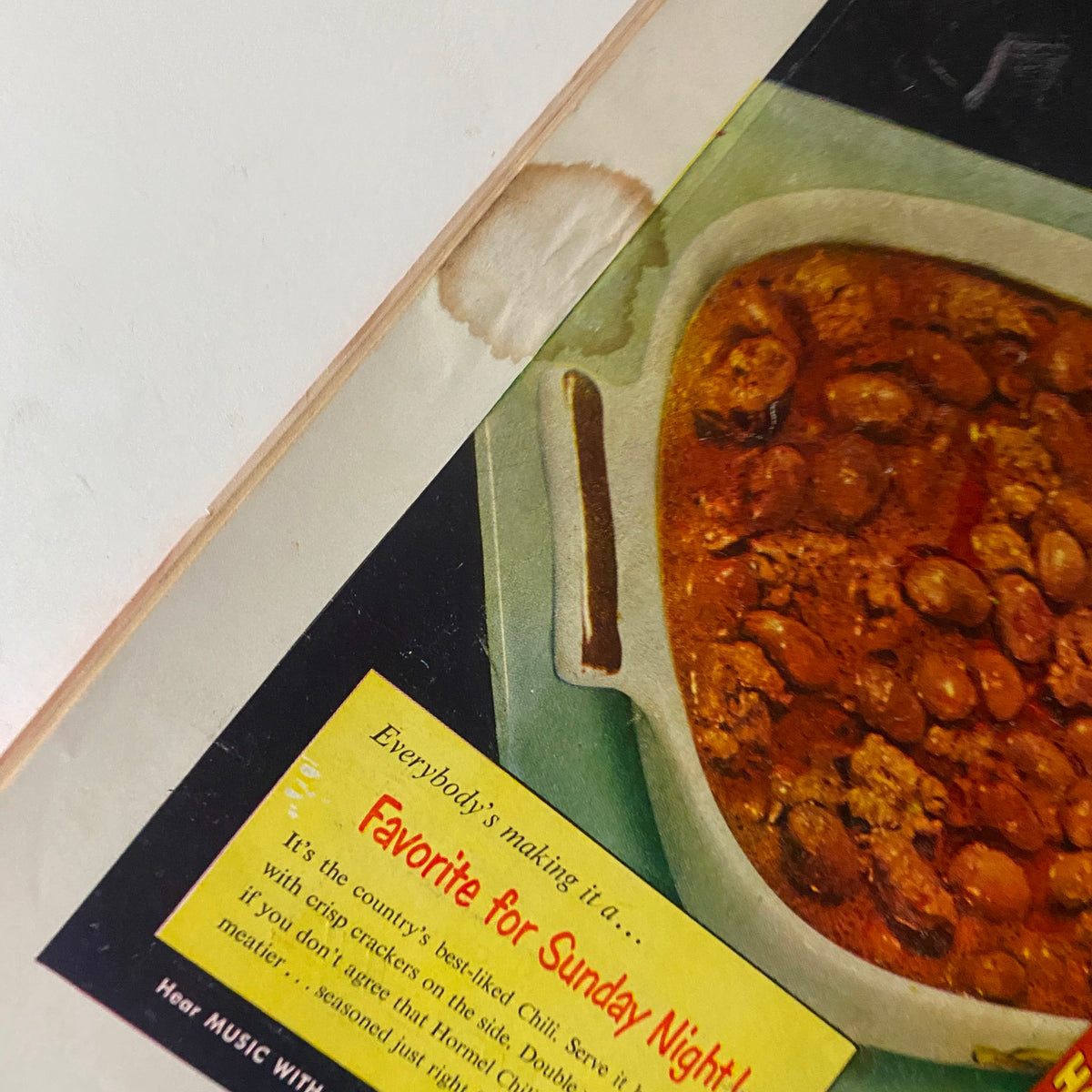 Close-up of the Hormel Chili advertisement from VTG Time Magazine April 27, 1953, detailing its features as a popular dish for Sunday night with vibrant imagery and enticing description.