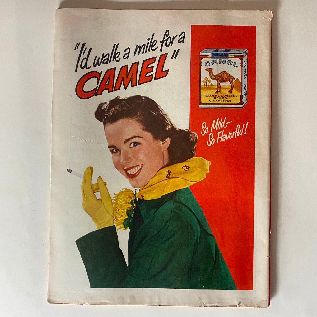 Vintage advertisement featuring a smiling woman with a cigarette, captioned 'I'd walk a mile for a CAMEL', alongside a box of Camel cigarettes. This image is associated with the VTG Time Magazine from November 3, 1952 featuring Dwight D. Eisenhower.
