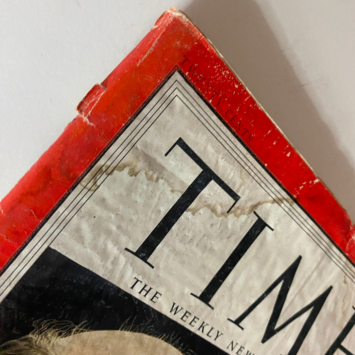 Close-up on the top corner of VTG Time Magazine April 6, 1953, highlighting wear and tear indicative of its vintage status.