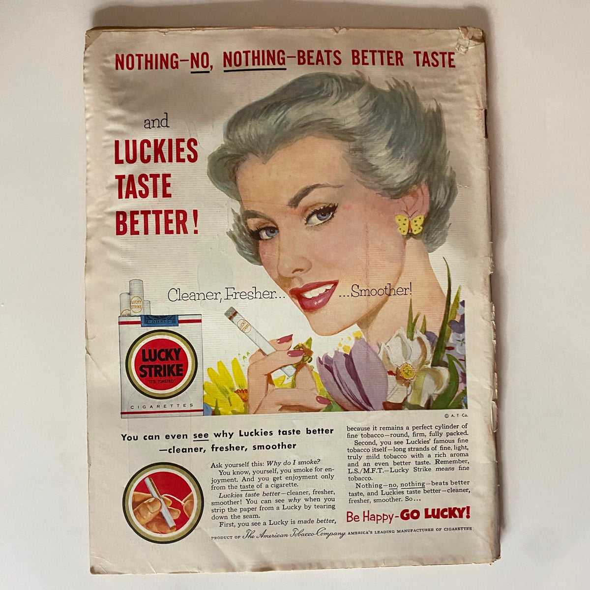Vintage advertisement from VTG Time Magazine April 6, 1953, featuring a model promoting Lucky Strike cigarettes under the tagline 'Nothing beats better taste!'.